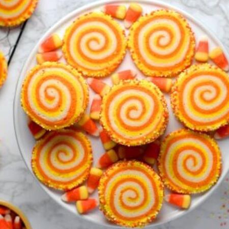 Orange and yellow candy corn swirled cakes