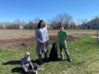 The Caccia family even brought their fur- family member to participate in tree planting.
