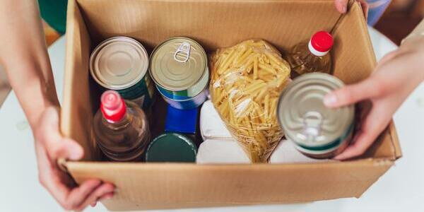 box of canned and packaged food items