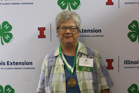 woman wearing medallion